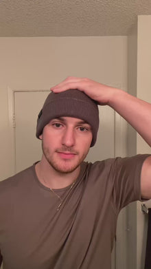 Video explaining the benefits of wearing a silk-lined hat for hair protection, featuring user testimonials.
